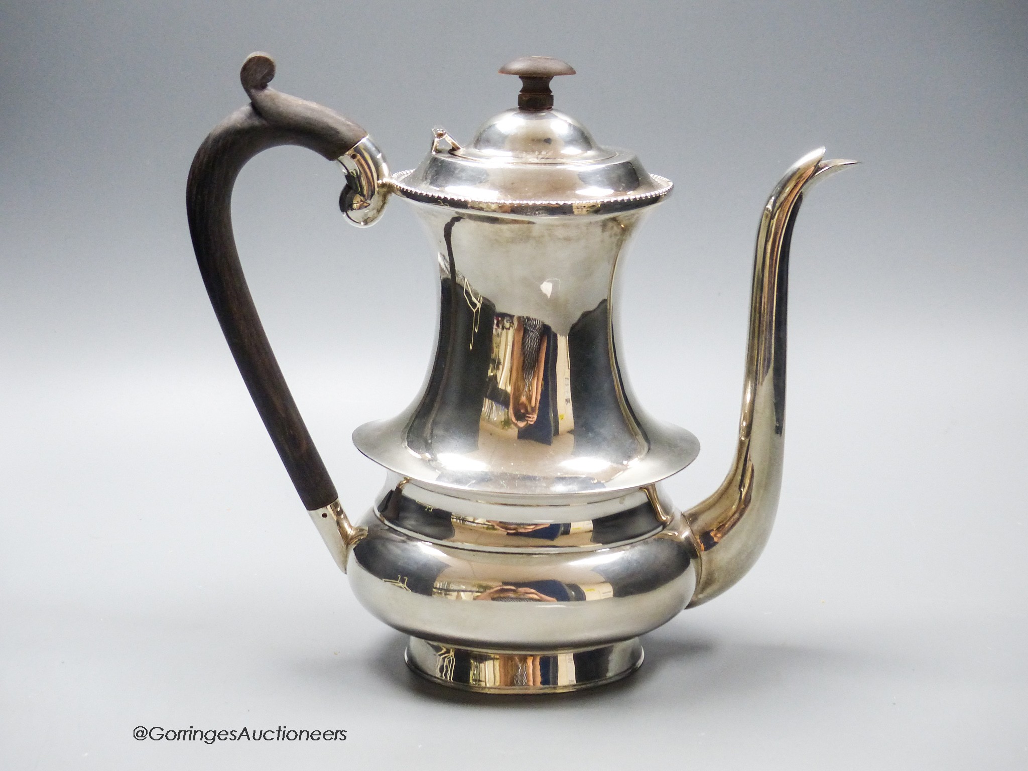 A white metal (stamped sterling silver) coffee pot, height 22cm, gross weight 26.5oz.
